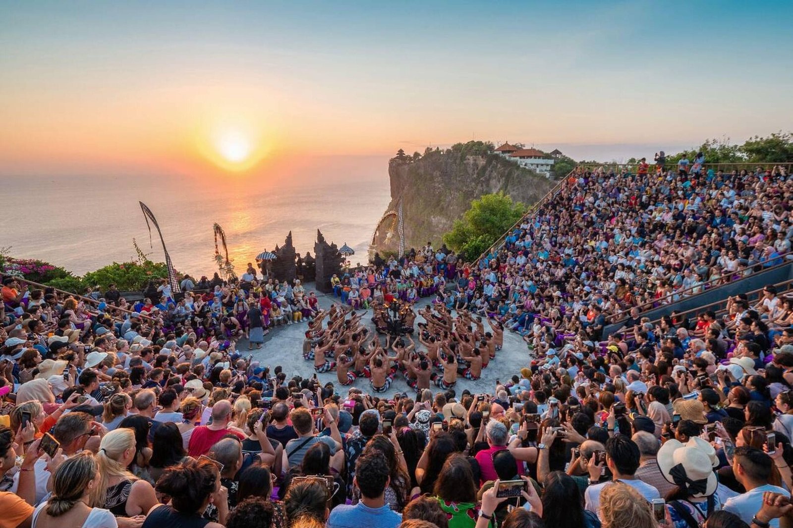 Sunset view of Uluwatu Temple perched on cliffs in Bali.